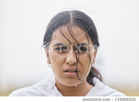 Rain, fitness and face portrait of woman in training resting on a cardio workout break outdoors in nature. Runner, winter and healthy Indian girl sweating in raining weather after sports exercise Rain, fitness and face portrait of woman in training resting on a cardio workout break outdoors in nature. Runner, winter and healthy Indian girl sweating in raining weather after sports exercise 138906920