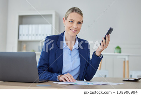 Business woman, accounting executive and finance manager planning on phone while reading data, strategy and paperwork for report in an office. Portrait of a leader, analyst and worker with analytics 138906994