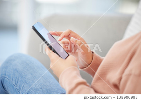 Social media, online shopping and communication, a world on her phone, woman surfing the web. Mobile lifestyle and internet, girl sitting on a sofa, working at home and checking smartphone for email. 138906995