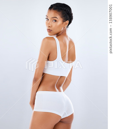 Health, body care and portrait of back of woman in underwear with healthy diet, exercise and balance in studio. Fitness, nutrition and skincare, beauty and slim fit figure isolated on grey background Health, body care and portrait of back of woman in underwear with healthy diet, exercise and balance in studio. Fitness, nutrition and skincare, beauty and slim fit figure isolated on grey background 138907001