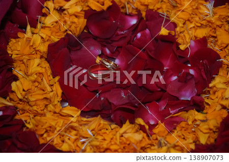 Wedding rings are placed on flower petals Wedding rings are placed on flower petals 138907073