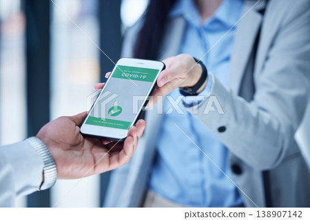 Covid, hands and vaccine passport on smartphone for travel, safety or security during virus pandemic at the airport. Woman hand in corona QR code for international or global traveling on phone app Covid, hands and vaccine passport on smartphone for travel, safety or security during virus pandemic at the airport. Woman hand in corona QR code for international or global traveling on phone app 138907142