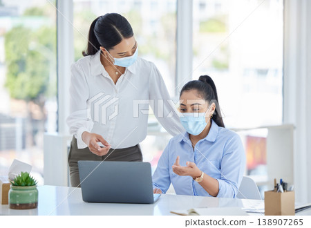 Covid, work and business women in the office with laptop and wearing face mask. Tech, 404 and team working to fix problem, mistake and glitch on computer with mask in the workplace for covid 19 138907265