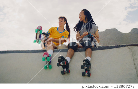 Rollerskate, skatepark and fun with a couple of friends sitting outdoor on a ramp for recreation together. Fitness, diversity or sports with a man and woman bonding outside for an active hobby Rollerskate, skatepark and fun with a couple of friends sitting outdoor on a ramp for recreation together. Fitness, diversity or sports with a man and woman bonding outside for an active hobby 138907272