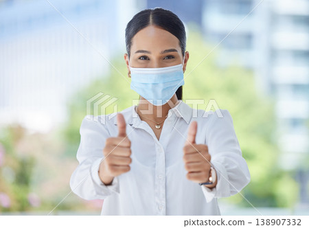 Face mask, covid compliance or thumbs up woman with hand, vision or wellness goal to stop global virus. Portrait business woman, employee or corporate worker with trust vote or vaccine support 138907332