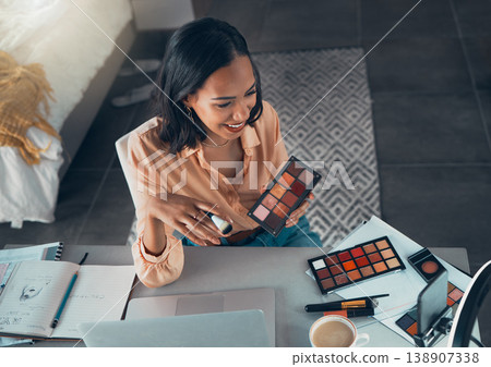 Female lifestyle, makeup vlogger recording a tutorial on phone for social media. Top view of beauty influencer testing eyeshadow palette colors or cosmetics on a live streaming video to share online Female lifestyle, makeup vlogger recording a tutorial on phone for social media. Top view of beauty influencer testing eyeshadow palette colors or cosmetics on a live streaming video to share online 138907338