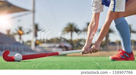Hockey, sports and woman athlete on a turf field with a stick and ball for exercise, training and competition performance to win. Hands of hockey player on grass for sport goal, fitness and health Hockey, sports and woman athlete on a turf field with a stick and ball for exercise, training and competition performance to win. Hands of hockey player on grass for sport goal, fitness and health 138907766