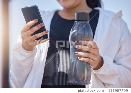 Exercise, phone and water for woman using fitness app to check progress, steps and health while outdoor for workout, running and training. Athlete runner with bottle and smartphone for social network Exercise, phone and water for woman using fitness app to check progress, steps and health while outdoor for workout, running and training. Athlete runner with bottle and smartphone for social network 138907799