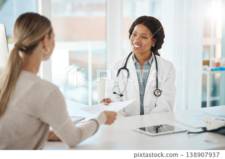 Doctor and patient discuss paperwork during medical consultation in a hospital. Healthcare professional, GP or physician prepare insurance document and checking personal information at a clinic Doctor and patient discuss paperwork during medical consultation in a hospital. Healthcare professional, GP or physician prepare insurance document and checking personal information at a clinic 138907937