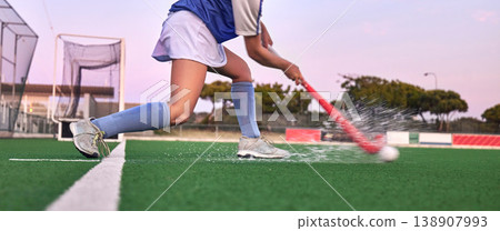 Hockey, stick and ball with a water splash on grass during exercise, training and fitness workout for a game, competition or match. Legs of athlete on sports field for goal, challenge and battle Hockey, stick and ball with a water splash on grass during exercise, training and fitness workout for a game, competition or match. Legs of athlete on sports field for goal, challenge and battle 138907993