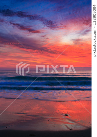 The dawn on Tanegashima Island, a calm sea and a sky of vibrant colors. The dawn on Tanegashima Island, a calm sea and a sky of vibrant colors. 138909094