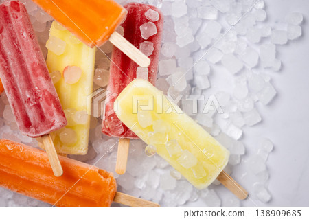 Colorful fruit popsicles on crushed ice 138909685