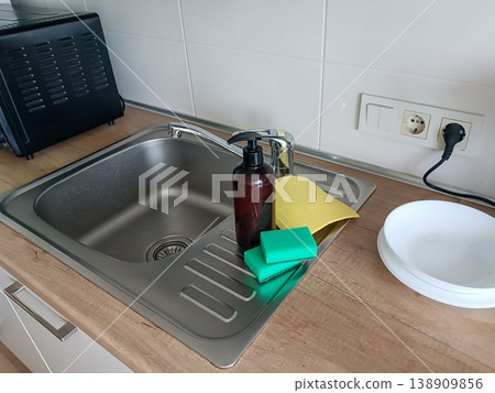Kitchen Sink Basin with Cleaning Supplies Kitchen Sink Basin with Cleaning Supplies 138909856