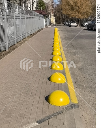 Yellow Concrete Parking Bollards 138909874