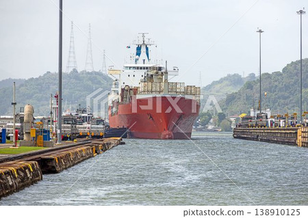 Cargo ship in Panama Canal lock with infrastructure Cargo ship in Panama Canal lock with infrastructure 138910125