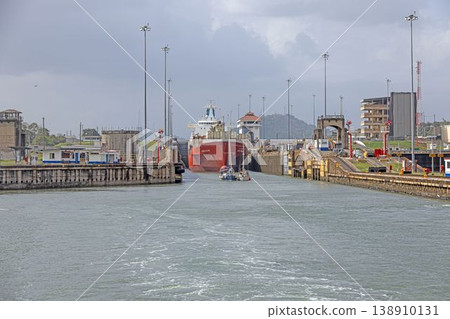 Panama Canal lock with cargo ship passing through gates 138910131