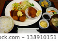 A set meal that includes large fried oysters and crab cream croquettes. 138910151
