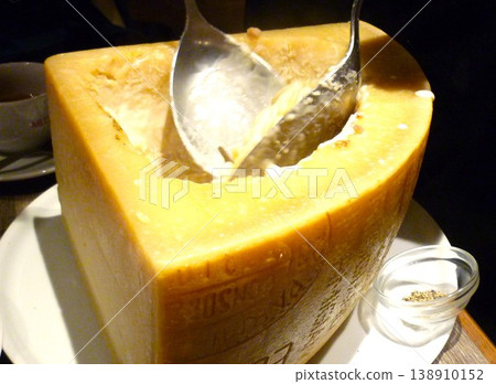 Carbonara mixed with a large cheese 138910152