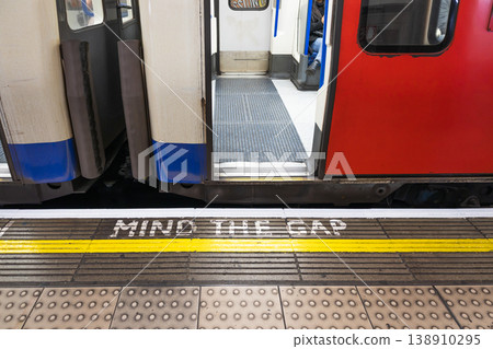 Mind the gap warning sign at London underground station Mind the gap warning sign at London underground station 138910295