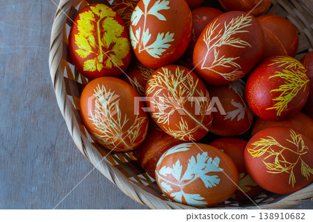Easter eggs dyed with onion peel, dill and parsley. Natural eco dyes. Egg on the table top view food background. Easter eggs dyed with onion peel, dill and parsley. Natural eco dyes. Egg on the table top view food background. 138910682
