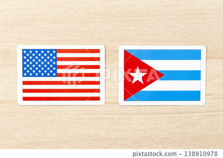 American and Cuban flags placed on the table American and Cuban flags placed on the table 138910978