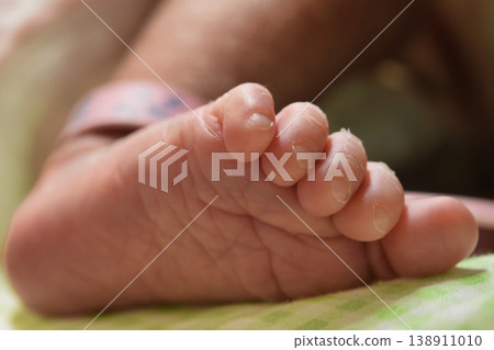 A soothing close-up capturing the gentle soles of a baby's tiny feet. A soothing close-up capturing the gentle soles of a baby's tiny feet. 138911010