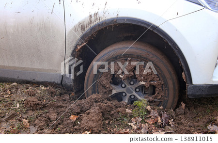 Front wheel of car got got stuck in the mud Front wheel of car got got stuck in the mud 138911015