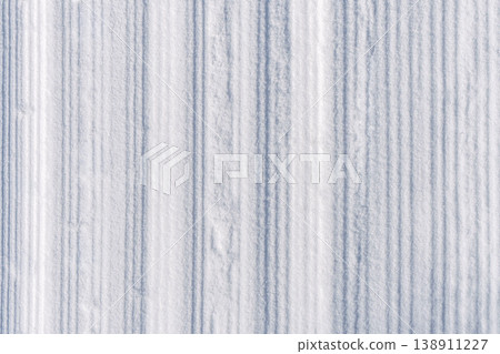 Peaceful groomed snow trail featuring minimalist landscape and subtle morning light reflections Peaceful groomed snow trail featuring minimalist landscape and subtle morning light reflections 138911227