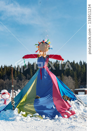 Burning of scarecrow during Maslenitsa holiday shows sequence of events in ceremony. Scene two: flames emerged Burning of scarecrow during Maslenitsa holiday shows sequence of events in ceremony. Scene two: flames emerged 138911234