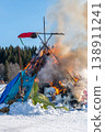 Burning down straw effigy at Maslenitsa festival shows framework amid strong flames and smoke 138911241