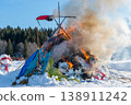 Burning down straw effigy at Maslenitsa festival with visible framework in intense fire 138911242