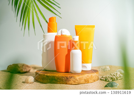Sun care bottles on wood stand Sun care bottles on wood stand 138911619