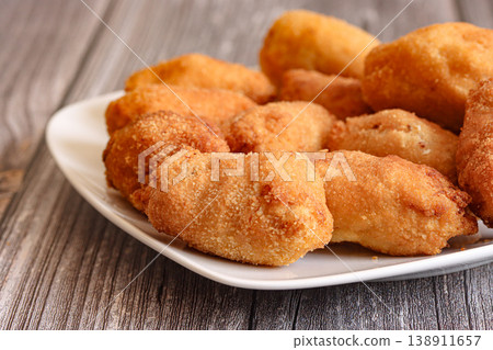 Homemade croquettes on plate with rustic wooden background 138911657