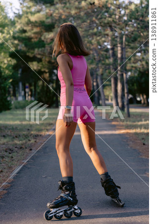 Sporty woman rollerblading in park, active healthy lifestyle concept. 138911861