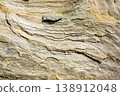 grunge texture of yellowish gray stone. natural rock background shot outside. aged matte patterns of sandstone with subtle cracks 138912048