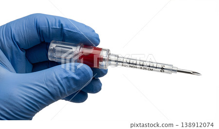 Gloved hand holding a thoracic decompression needle for tension pneumothorax treatment, representing emergency medicine and critical care Gloved hand holding a thoracic decompression needle for tension pneumothorax treatment, representing emergency medicine and critical care 138912074