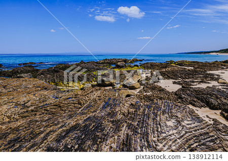 The rocky area of Kumano Beach, reflected in the blue sky and sea. The rocky area of Kumano Beach, reflected in the blue sky and sea. 138912114