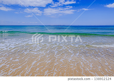 Tanegashima's Kumano Beach boasts crystal-clear waters and beautiful sandy shores. Tanegashima's Kumano Beach boasts crystal-clear waters and beautiful sandy shores. 138912124