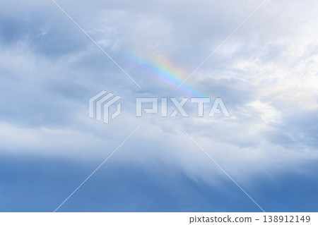 A fantastical rainbow appeared between the clouds. A fantastical rainbow appeared between the clouds. 138912149