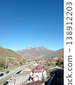 Hidikus mountain village, Kurtatinsky Gorge, North Ossetia, Russia, bright summer day. Small community of stone houses surrounded by Caucasus peaks 138912203