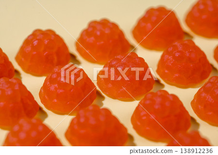 Jelly gummies close-up, fruit vitamins, food supplements.Orange vitamins candies Jelly gummies close-up, fruit vitamins, food supplements.Orange vitamins candies 138912236