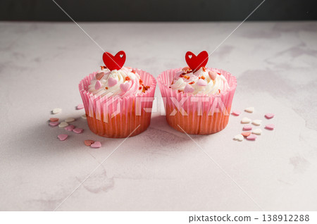 Valentine's day sweets. Pink cupcakes with hearts. Copy space 138912288
