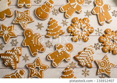 Holiday abstract background. Christmas gingerbread cookies, festive food, home baking. Flat lay Holiday abstract background. Christmas gingerbread cookies, festive food, home baking. Flat lay 138912407
