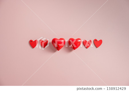 Valentine Day background with red hearts over pink background. St. Valentine's Day love concept, flat lay Valentine Day background with red hearts over pink background. St. Valentine's Day love concept, flat lay 138912429