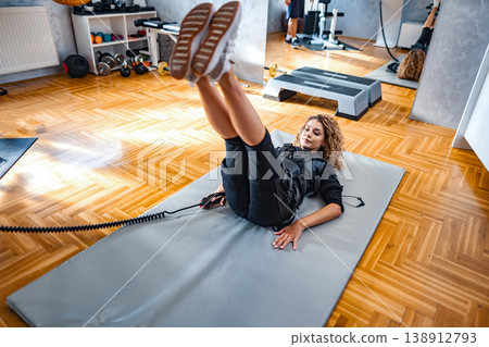 Get full-body fitness with at-home e-stimulation 138912793