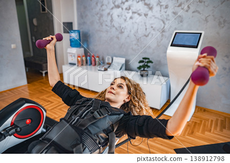 Person does creative indoor muscle training Person does creative indoor muscle training 138912798