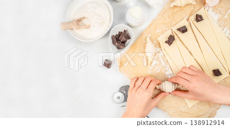 Making croissants with chocolate filling, baking process, top view 138912914