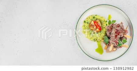 Grilled meat skewers with couscous on plate and copy space on light background Grilled meat skewers with couscous on plate and copy space on light background 138912982