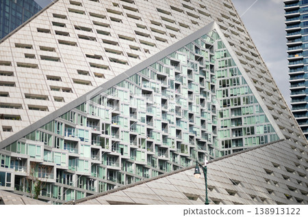 Cityscape Featuring Modern Building Designs With Geometric Shapes And Glass Facades 138913122