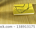 Glasses on book 138913175